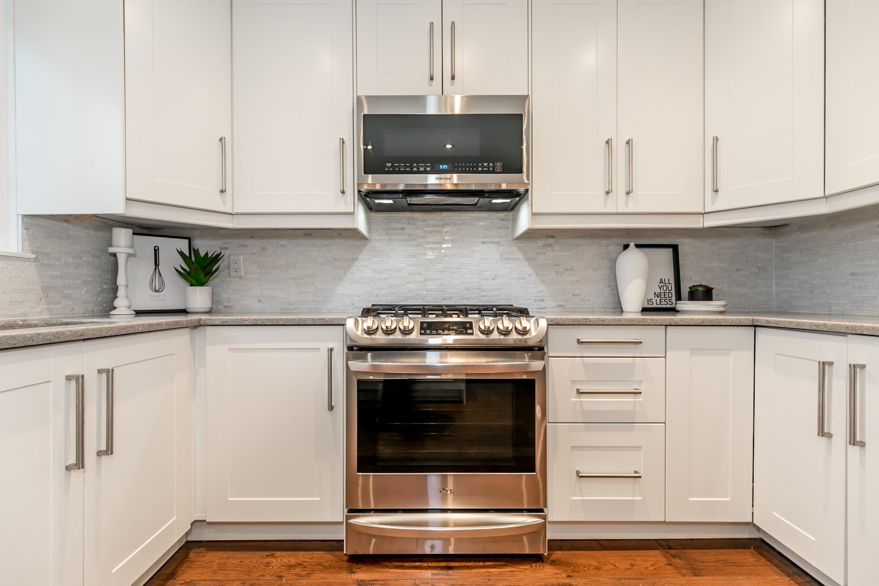 Completed Hilltop kitchen cabinetry and range wall