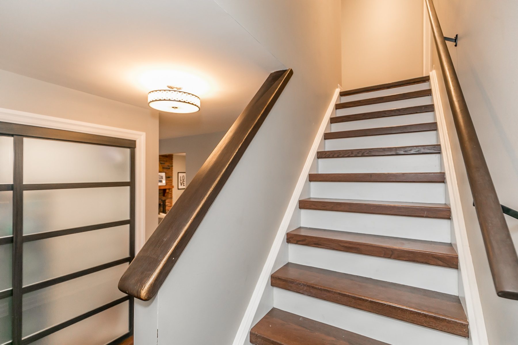 Finished Hilltop staircase with dark railing
