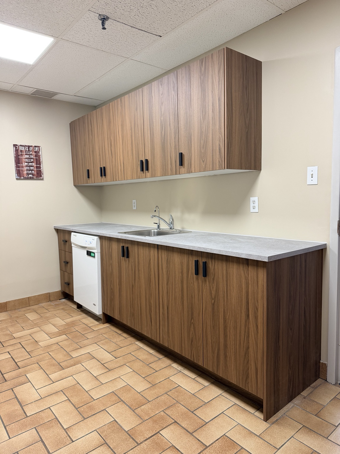 Completed kitchen cabinetry, counter, sink and hardware