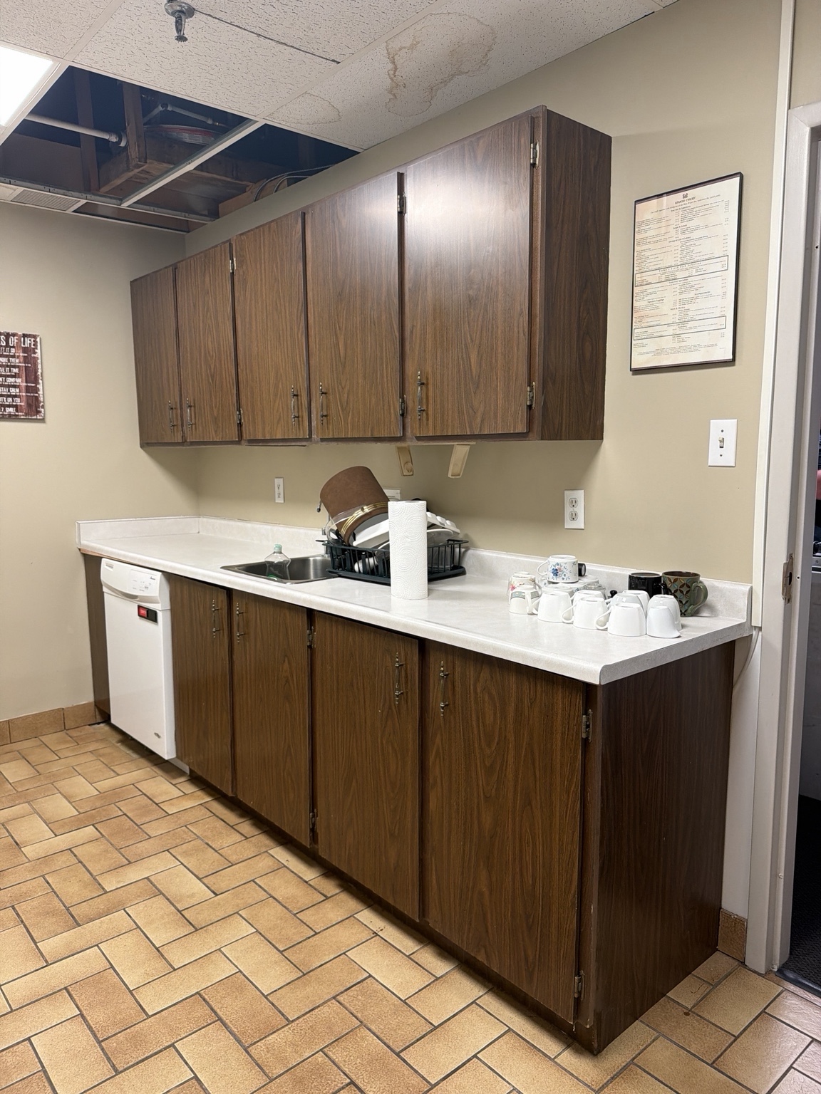 Existing cabinets, counter and ceiling damage before work