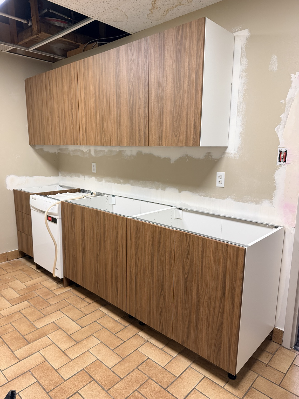 New office kitchen cabinet boxes and fronts during installation