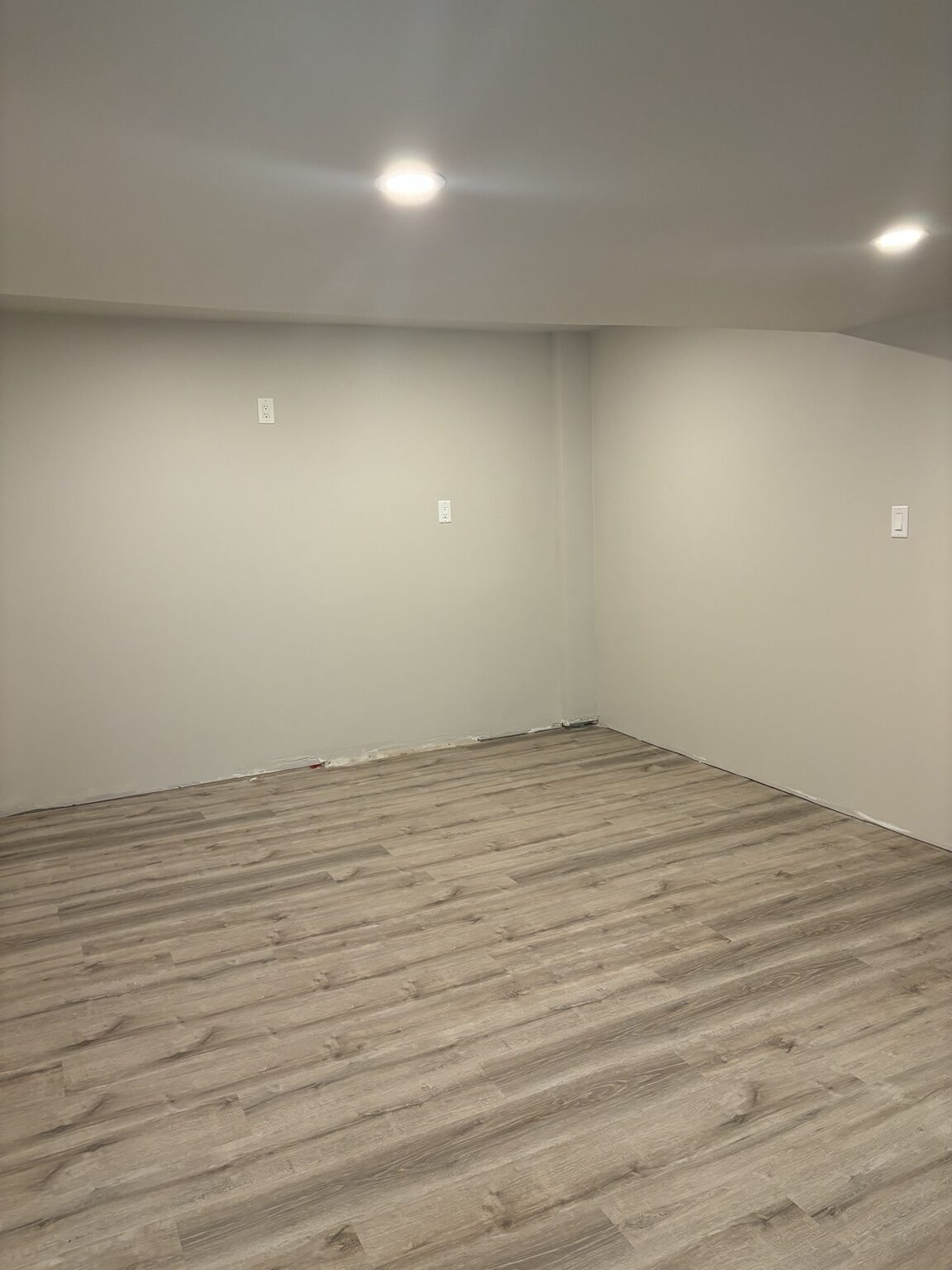 Completed Melrose-area exercise room with smooth ceiling and painted walls