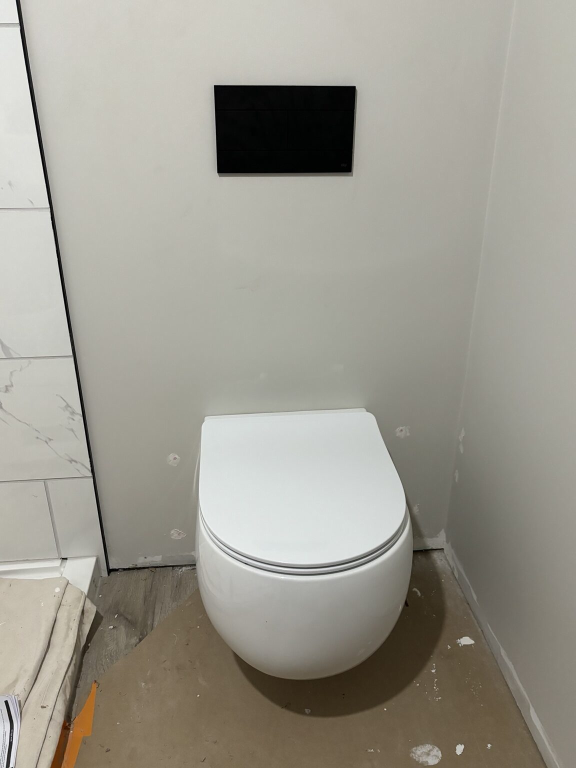 Wall-hung toilet installed during the Melrose-area bathroom renovation