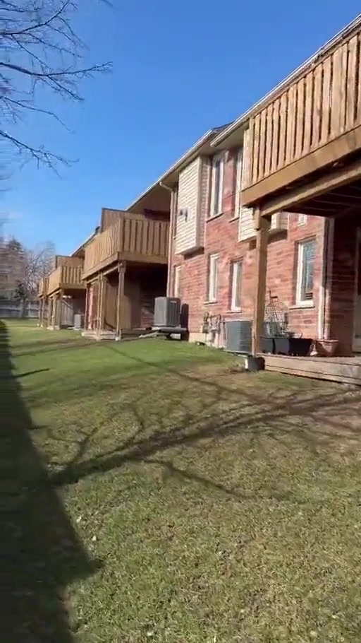 Completed row of renewed rear decks viewed along the anonymous multi-unit property