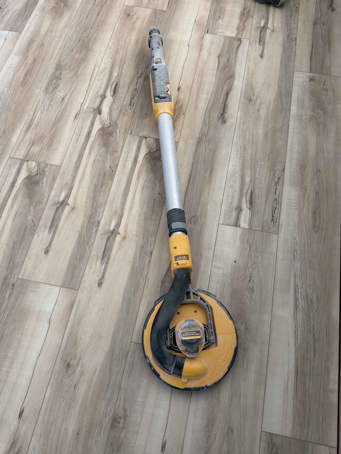 Ceiling sander used during popcorn ceiling removal