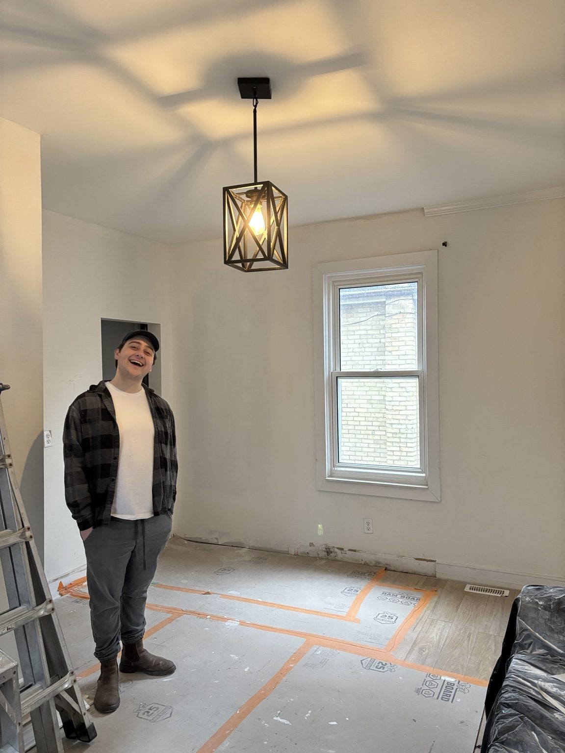 Protected room prepared for drywall finishing
