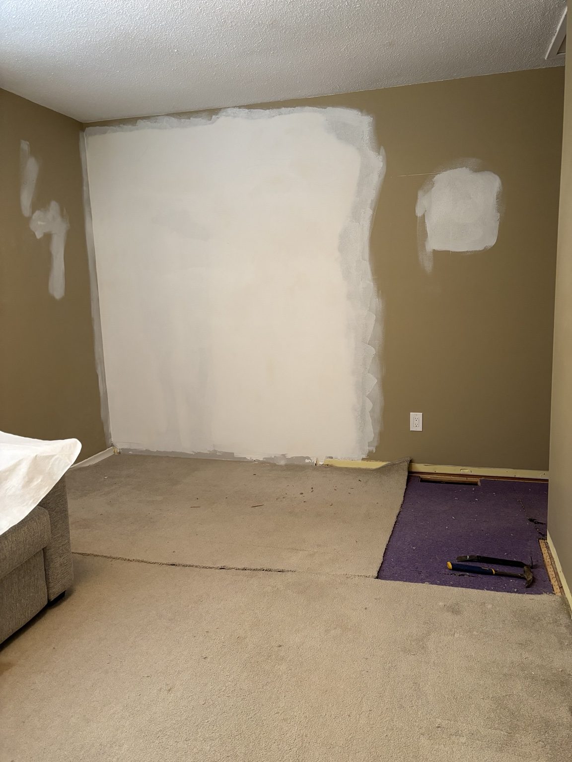 Drywall patching and compound on an interior wall