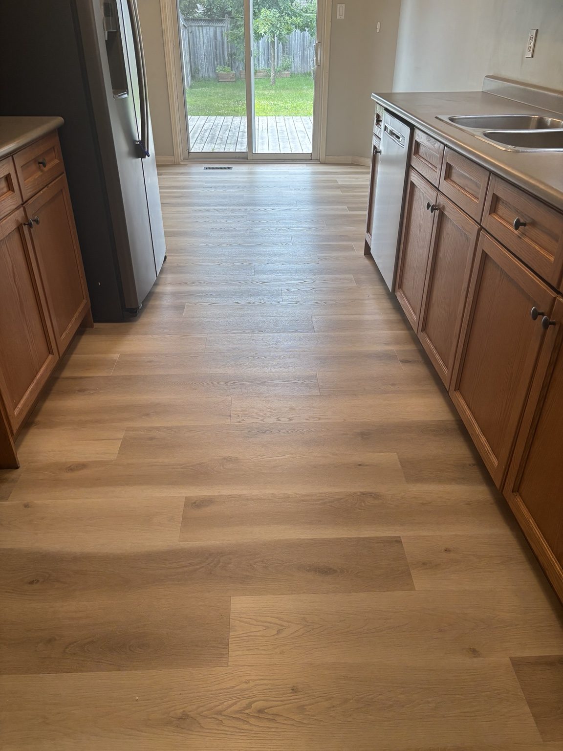 New flooring installed through a kitchen