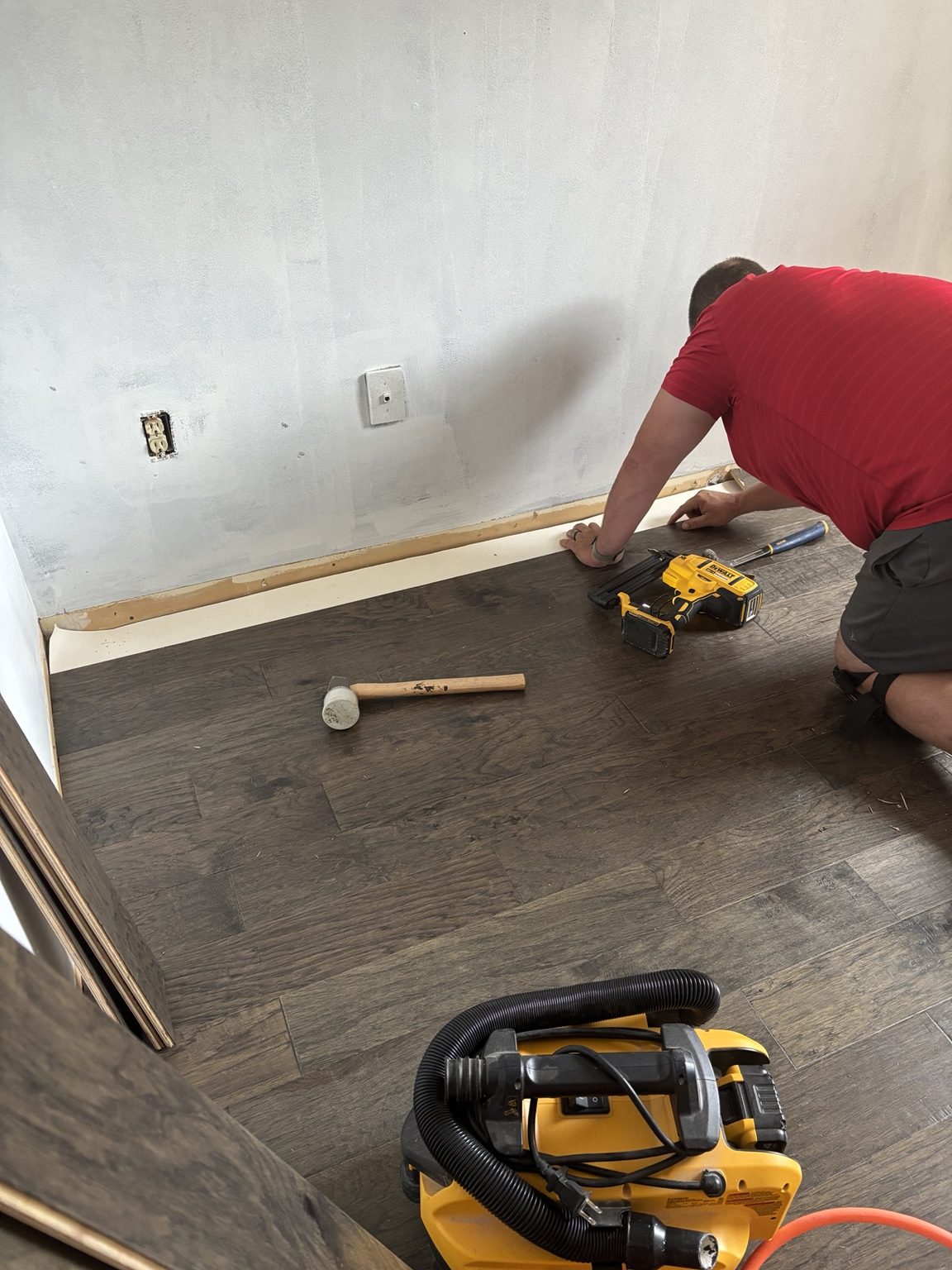Plank flooring being installed in a residential room