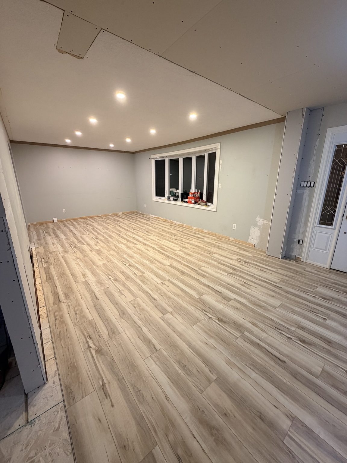 Completed plank flooring in a renovated room