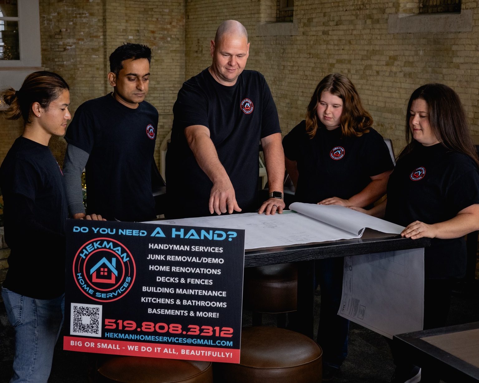 Hekman Home Services team reviewing plans