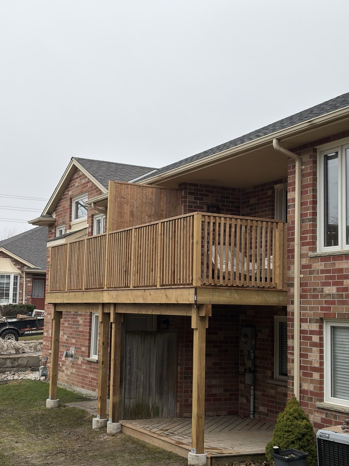 Wood deck and railing at a residential property