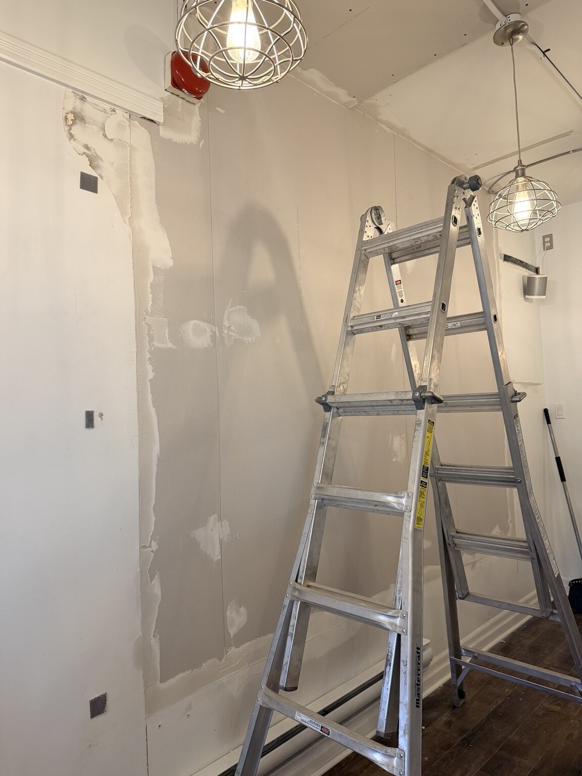 Wall and ceiling surfaces being rebuilt in an anonymous London salon
