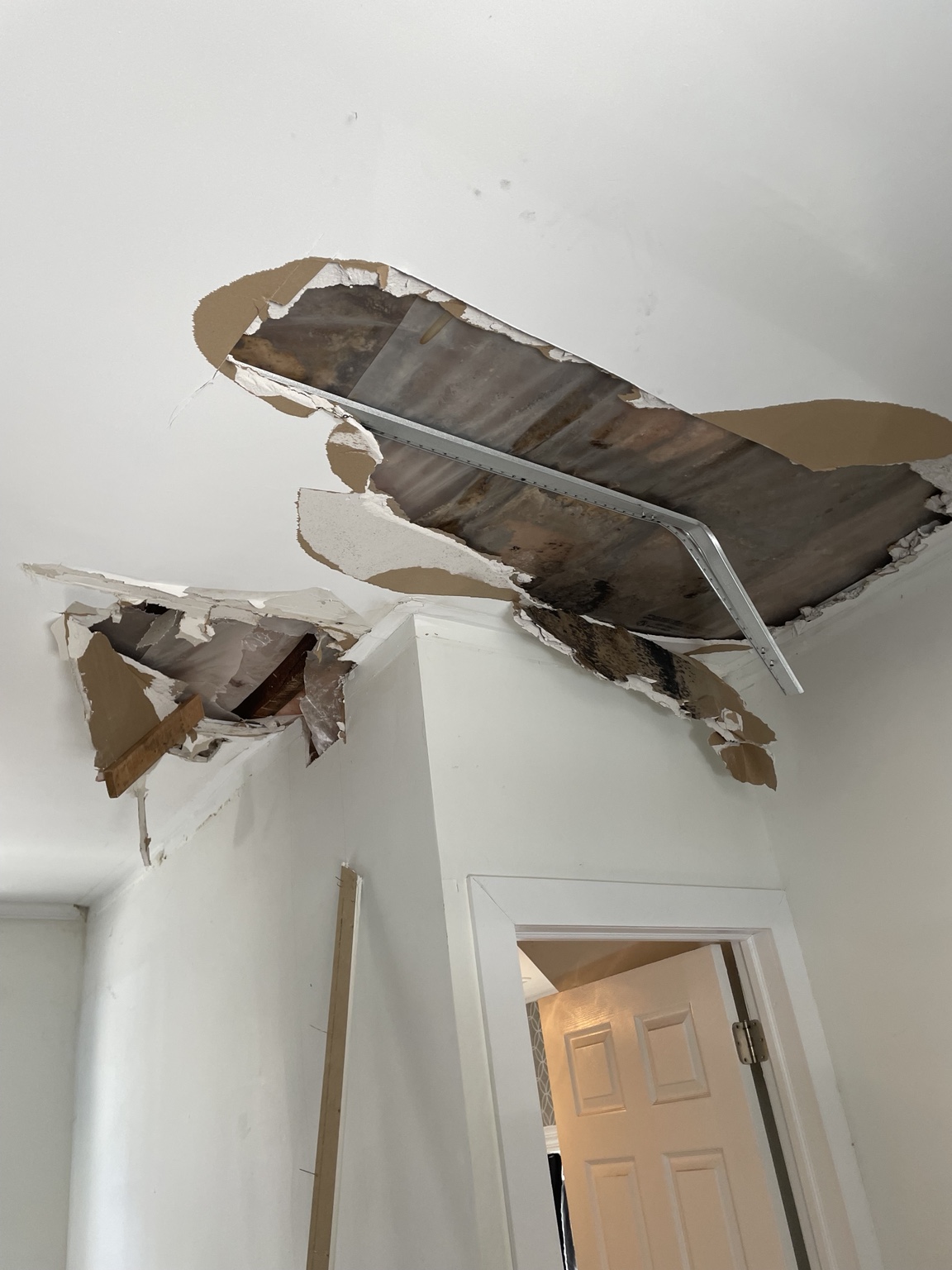 Damaged ceiling opened for restorative repair