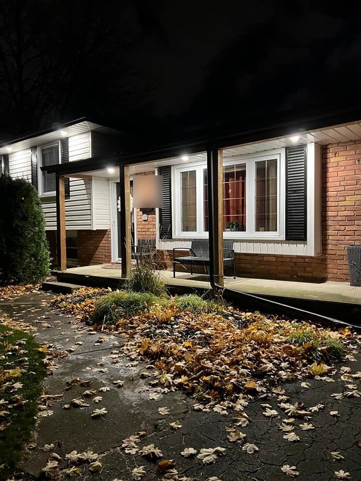 Finished Westmount porch and entry illuminated at night
